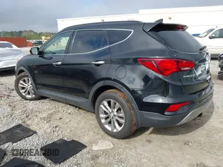 2018 Hyundai Santa Fe 2.0T z VIN 5NMZUDLA3JH057978, wystawiony jako IAAI lot #41930580 z przebiegiem 118 100 mil mil oraz . Historia ofert i sprzedaży dostępna na DreamBid. Obrazek 3.