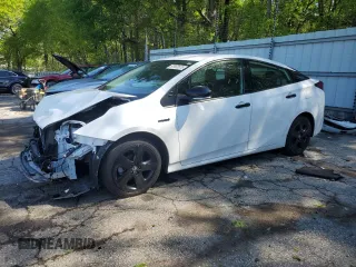 2022 Toyota Prius L Eco z VIN JTDKAMFU3N3167627, wystawiony jako Copart lot #52902875 z przebiegiem 74 595 mil mil oraz Szkoda całkowita • Salvage title. Historia ofert i sprzedaży dostępna na DreamBid. Obrazek 1.