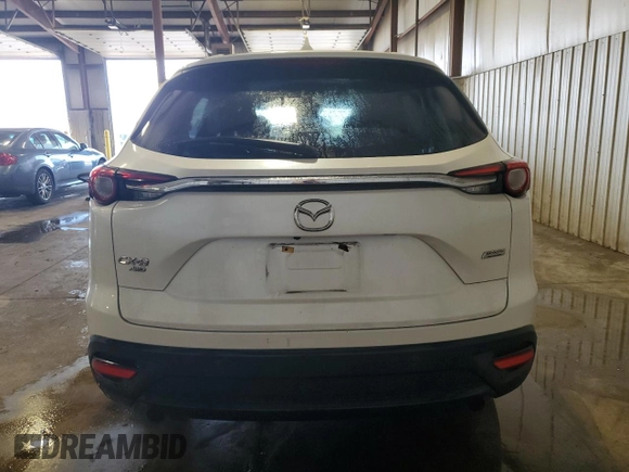 2019 Mazda CX-9 Touring with VIN JM3TCBCY3K0317900, listed as a Copart auction lot 64180945 with 63,721 mi miles and Salvage title. Bid and sale history available at DreamBid. Image 6.