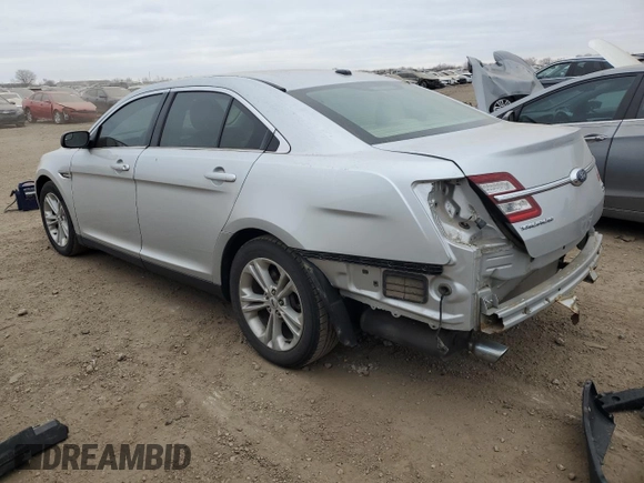 2016 Ford Taurus SEL with VIN 1FAHP2E9XGG144955, listed as a Copart auction lot 82207634 with 128,823 mi miles and Salvage Title. Bid and sale history available at DreamBid. Image 2.