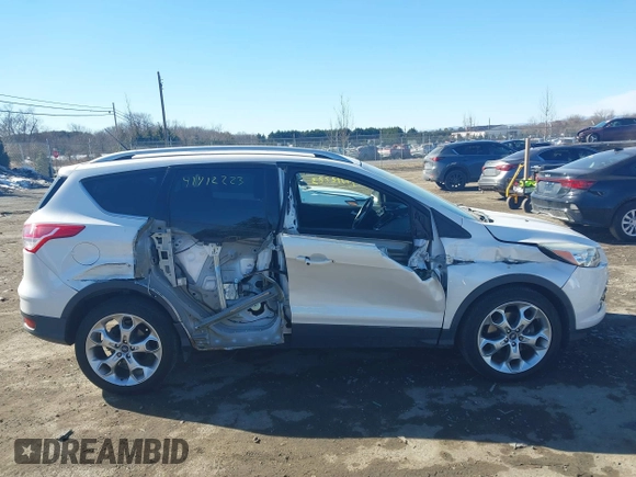 2016 Ford Escape Titanium with VIN 1FMCU9J96GUB65441, listed as a IAAI auction lot 41412223 with 74,218 mi miles. Bid and sale history available at carsss.com. Image 13.