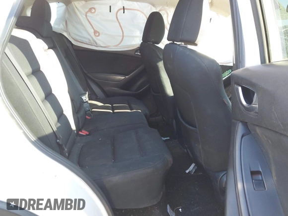 2016 Mazda CX-5 Touring z VIN JM3KE2CY9G0807688, wystawiony jako IAAI lot #41039438 z przebiegiem 169 483 mil mil oraz . Historia ofert i sprzedaży dostępna na DreamBid. Obrazek 8.