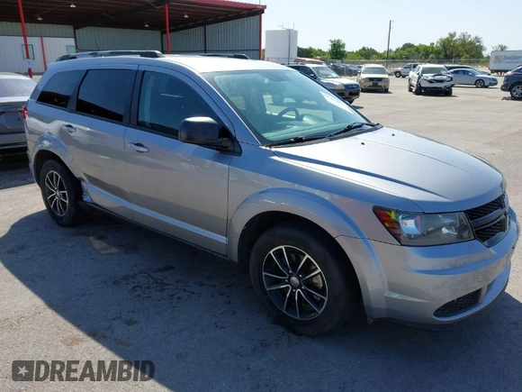 2017 Dodge Journey SE z VIN 3C4PDCAB1HT573511, wystawiony jako IAAI lot #41984865 z przebiegiem 128 721 mil mil oraz . Historia ofert i sprzedaży dostępna na DreamBid. Obrazek 1.