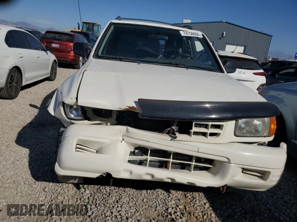 1999 Isuzu Rodeo S with VIN 4S2CM58W0X4306727, listed as a Copart auction lot 74758994 with 193,850 mi miles and Clean title. Bid and sale history available at DreamBid. Image 5.