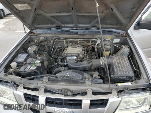 2004 Isuzu Rodeo S with VIN 4S2CK58W344311048, listed as a Copart auction lot 45154765 with 128,733 mi miles and Clean Title. Bid and sale history available at DreamBid. Image 12.