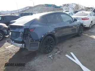 2022 Tesla Model Y Long Range z VIN 7SAYGDEE6NA013757, wystawiony jako IAAI lot #41364867 z przebiegiem 33 621 mil mil oraz . Historia ofert i sprzedaży dostępna na DreamBid. Obrazek 4.