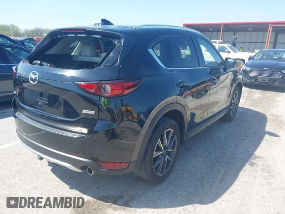 2018 Mazda CX-5 Grand Touring with VIN JM3KFADM2J1324547, listed as a IAAI auction lot 41947497 with 66,254 mi miles. Bid and sale history available at carsss.com. Image 4.