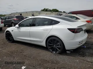 2019 Tesla Model 3 Mid Range z VIN 5YJ3E1EA2KF486532, wystawiony jako Copart lot #58082635 z przebiegiem 51 920 mil mil oraz Tytuł czysty. Historia ofert i sprzedaży dostępna na DreamBid. Obrazek 2.
