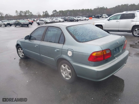 1999 Honda Civic EX with VIN 1HGEJ8643XL010821, listed as a IAAI auction lot 41602036 with 165,139 mi miles. Bid and sale history available at carsss.com. Image 3.