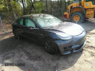 2020 Tesla Model 3 Standard Range Plus with VIN 5YJ3E1EA7LF598910, listed as a IAAI auction lot 42030288 with 95,811 mi miles. Bid and sale history available at carsss.com. Image 1.