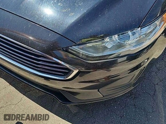 2020 Ford Fusion SE z VIN 3FA6P0LU6LR177022, wystawiony jako IAAI lot #41970574 z przebiegiem 106 169 mil mil oraz . Historia ofert i sprzedaży dostępna na DreamBid. Obrazek 1.