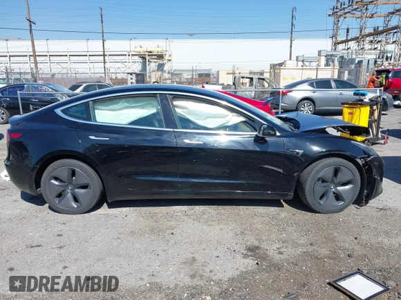 2018 Tesla Model 3 Long Range Battery with VIN 5YJ3E1EB9JF183920, listed as a IAAI auction lot 41657742 with 107,358 mi miles and . Bid and sale history available at DreamBid. Image 12.