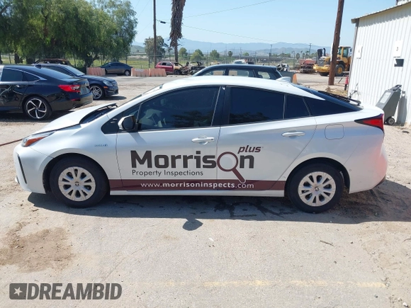 2021 Toyota Prius L Eco with VIN JTDKAMFU8M3133925, listed as a IAAI auction lot 41966660 with 115,193 mi miles. Bid and sale history available at carsss.com. Image 14.