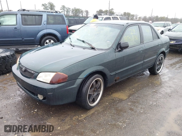 2000 Mazda Protege DX with VIN JM1BJ2225Y0255349, listed as a IAAI auction lot 41604895 with Not Provided miles and . Bid and sale history available at DreamBid. Image 2.