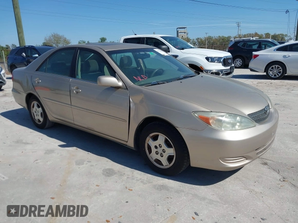 2002 Toyota Camry XLE z VIN 4T1BF30K82U018974, wystawiony jako IAAI lot #41712857 z przebiegiem 236 353 mil mil oraz . Historia ofert i sprzedaży dostępna na DreamBid. Obrazek 1.