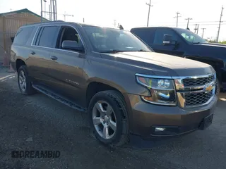 2016 Chevrolet Suburban LT z VIN 1GNSCHKC5GR293204, wystawiony jako IAAI lot #41997876 z przebiegiem 163 298 mil mil oraz . Historia ofert i sprzedaży dostępna na DreamBid. Obrazek 1.