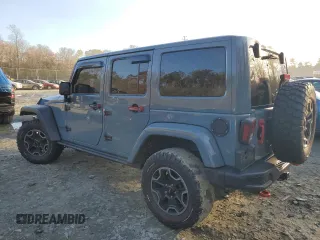 2015 Jeep Wrangler Unlimited Rubicon Hard Rock with VIN 1C4HJWFGXFL671660, listed as a Copart auction lot 82329074 with 214,579 mi miles and Salvage title. Bid and sale history available at DreamBid. Image 2.