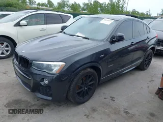 2015 BMW X4 xDrive28i with VIN 5UXXW3C54F0M88740, listed as a IAAI auction lot 42275157 with 159,281 mi miles and . Bid and sale history available at DreamBid. Image 2.