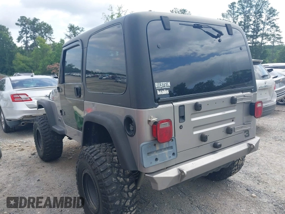 2002 Jeep Wrangler Sport with VIN 1J4FA49S52P717811, listed as a IAAI auction lot 42449753 with 252,258 mi miles and . Bid and sale history available at DreamBid. Image 3.