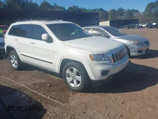 2012 Jeep Grand Cherokee Laredo with VIN 1C4RJEAG5CC106203, listed as a IAAI auction lot 41821138 with 157,474 mi miles. Bid and sale history available at carsss.com. Image 1.