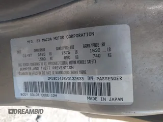 1997 Mazda Protege DX with VIN JM1BC1416V0132633, listed as a IAAI auction lot 42162630 with 234,300 mi miles and . Bid and sale history available at DreamBid. Image 9.