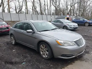 2014 Chrysler 200 Touring with VIN 1C3CCBBB1EN165049, listed as a IAAI auction lot 42005572 with 117,673 mi miles. Bid and sale history available at carsss.com. Image 1.