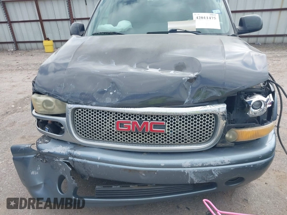 2004 GMC Yukon SLT z VIN 1GKEC13Z44J310511, wystawiony jako IAAI lot #42011475 z przebiegiem 218 746 mil mil oraz . Historia ofert i sprzedaży dostępna na DreamBid. Obrazek 10.