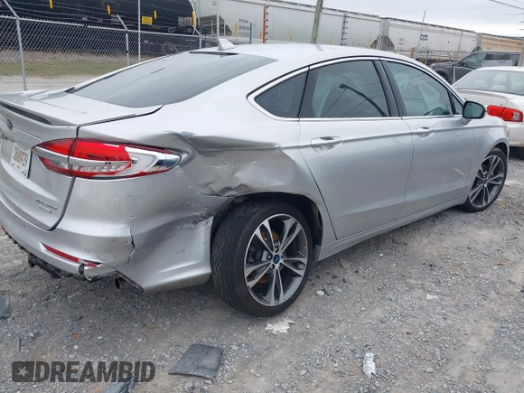 2019 Ford Fusion Titanium with VIN 3FA6P0K96KR120749, listed as a IAAI auction lot 40737085 with 118,376 mi miles and . Bid and sale history available at DreamBid. Image 4.