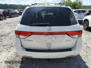 2014 Honda Odyssey Touring with VIN 5FNRL5H98EB053486, listed as a Copart auction lot 58004225 with 201,526 mi miles and Salvage title. Bid and sale history available at DreamBid. Image 6.