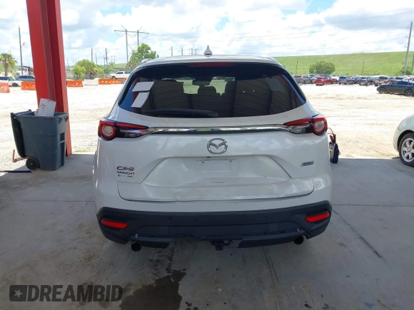 2016 Mazda CX-9 Grand Touring with VIN JM3TCADYXG0113563, listed as a IAAI auction lot 42593120 with 237,696 mi miles and . Bid and sale history available at DreamBid. Image 16.
