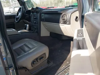 2005 Hummer H2 SUT with VIN 5GRGN22U15H114401, listed as a IAAI auction lot 41268764 with 166,651 mi miles. Bid and sale history available at carsss.com. Image 5.