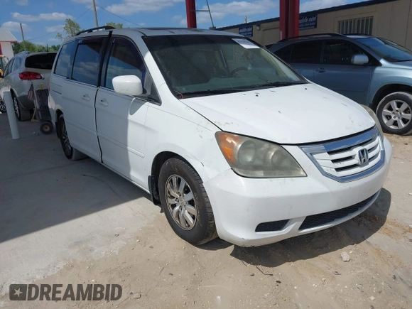 2009 Honda Odyssey EX-L with VIN 5FNRL386X9B056552, listed as a IAAI auction lot 42126144 with 194,722 mi miles. Bid and sale history available at carsss.com. Image 1.