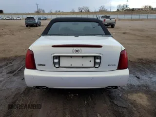 2004 Cadillac DeVille DTS z VIN 1G6KF57944U122824, wystawiony jako Copart lot #86147994 z przebiegiem 118 156 mil mil oraz Szkody całkowita. Historia ofert i sprzedaży dostępna na DreamBid. Obrazek 6.