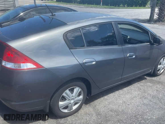 2011 Honda Insight LX z VIN JHMZE2H58BS005201, wystawiony jako Copart lot #57312335 z przebiegiem 195 020 mil mil oraz Czysty tytuł • Clean title. Historia ofert i sprzedaży dostępna na DreamBid. Obrazek 4.