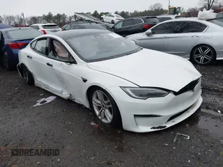 2023 Tesla Model S Plaid with VIN 5YJSA1E6XPF499815, listed as a IAAI auction lot 41017059 with Not provided miles and . Bid and sale history available at DreamBid. Image 1.