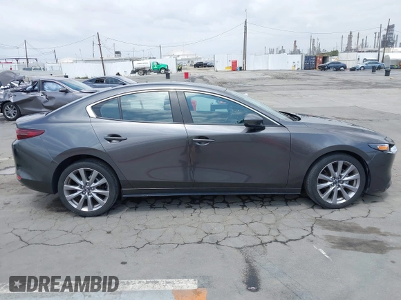2021 Mazda 3 Preferred with VIN 3MZBPACL4MM214814, listed as a IAAI auction lot 42115140 with 28,860 mi miles and . Bid and sale history available at DreamBid. Image 13.