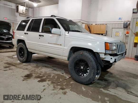 1997 Jeep Grand Cherokee Limited with VIN 1J4GZ78Y5VC747553, listed as a Copart auction lot 49125085 with 0 mi miles and Salvage Title. Bid and sale history available at carsss.com. Image 4.