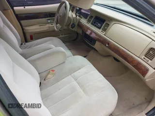 2006 Mercury Grand Marquis GS z VIN 2MEFM74VX6X655255, wystawiony jako IAAI lot #42261870 z przebiegiem Nie podano mil oraz . Historia ofert i sprzedaży dostępna na DreamBid. Obrazek 5.