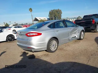 2014 Ford Fusion SE Hybrid with VIN 3FA6P0LU4ER206343, listed as a IAAI auction lot 41600260 with 198,834 mi miles and . Bid and sale history available at DreamBid. Image 4.