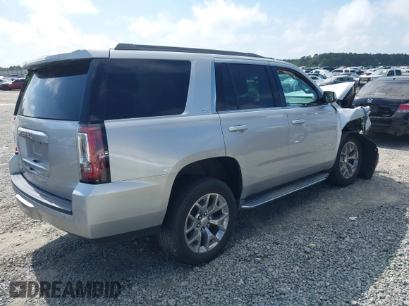 2015 GMC Yukon SLT z VIN 1GKS2BKC0FR100064, wystawiony jako IAAI lot #41941462 z przebiegiem 136 740 mil mil oraz . Historia ofert i sprzedaży dostępna na DreamBid. Obrazek 4.