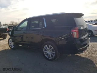 2021 Chevrolet Tahoe High Country with VIN 1GNSCTKLXMR105453, listed as a Copart auction lot 82807274 with 56,534 mi miles and Salvage Title. Bid and sale history available at carsss.com. Image 2.
