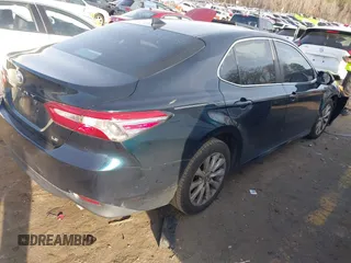2020 Toyota Camry LE with VIN 4T1C11AK0LU864863, listed as a IAAI auction lot 41748371 with 82,063 mi miles and . Bid and sale history available at carsss.com. Image 4.
