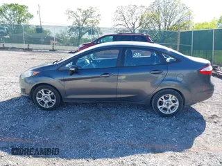 2015 Ford Fiesta SE z VIN 3FADP4BJ7FM158471, wystawiony jako IAAI lot #42090819 z przebiegiem 139 779 mil mil oraz . Historia ofert i sprzedaży dostępna na DreamBid. Obrazek 14.