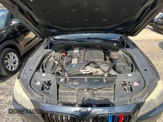 2012 BMW 7 Series 740Li with VIN WBAKB4C55CC576166, listed as a Copart auction lot 52448115 with 154,949 mi miles and Clean Title. Bid and sale history available at carsss.com. Image 7.