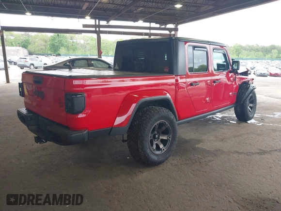 2021 Jeep Gladiator Willys with VIN 1C6HJTAG7ML602130, listed as a IAAI auction lot 42161745 with 49,576 mi miles and . Bid and sale history available at DreamBid. Image 4.
