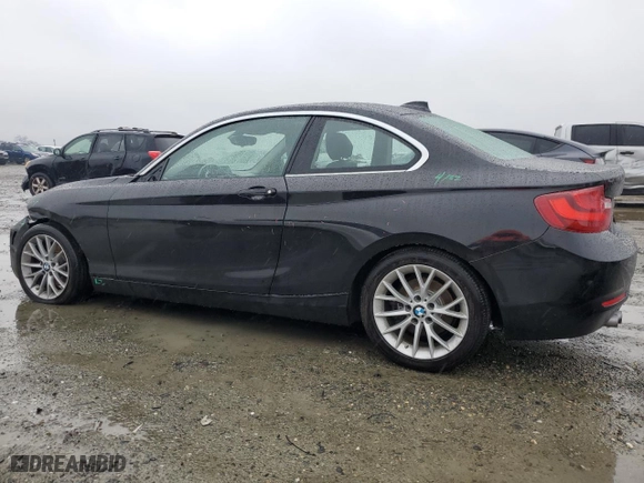 2014 BMW 2 Series 228i with VIN WBA1F5C51EVV99277, listed as a Copart auction lot 87306954 with 73,211 mi miles and Salvage Title. Bid and sale history available at carsss.com. Image 2.