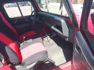 1995 Jeep Wrangler S z VIN 1J4FY19P5SP286845, wystawiony jako IAAI lot #42028886 z przebiegiem 155 841 mil mil oraz . Historia ofert i sprzedaży dostępna na DreamBid. Obrazek 5.