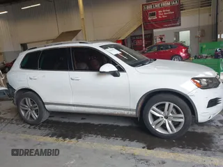 2013 Volkswagen Touareg Lux with VIN WVGEF9BP6DD007323, listed as a IAAI auction lot 41488959 with 123,383 mi miles and . Bid and sale history available at DreamBid. Image 14.