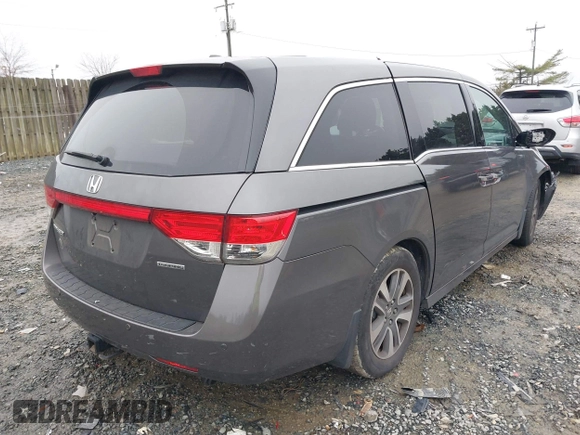 2015 Honda Odyssey Touring Elite with VIN 5FNRL5H92FB089627, listed as a IAAI auction lot 41115013 with Not Provided miles and . Bid and sale history available at DreamBid. Image 4.