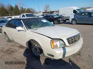 2001 Cadillac DeVille DHS z VIN 1G6KE57Y81U205386, wystawiony jako IAAI lot #41559104 z przebiegiem 128 086 mil mil oraz . Historia ofert i sprzedaży dostępna na DreamBid. Obrazek 1.